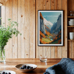 Lauterbrunnen Poster Print displayed on wooden wall in cozy home with flowers and tableware.