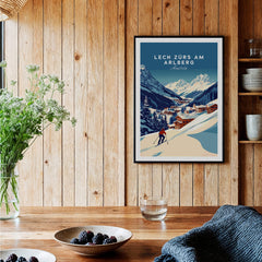 Lech Zürs am Arlberg Print Austria displayed on a wooden wall in a cozy home setting with plants and bowls.