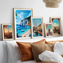 Lefkada Travel Print showcasing stunning scenes of Greece with framed travel posters on a cozy sofa.