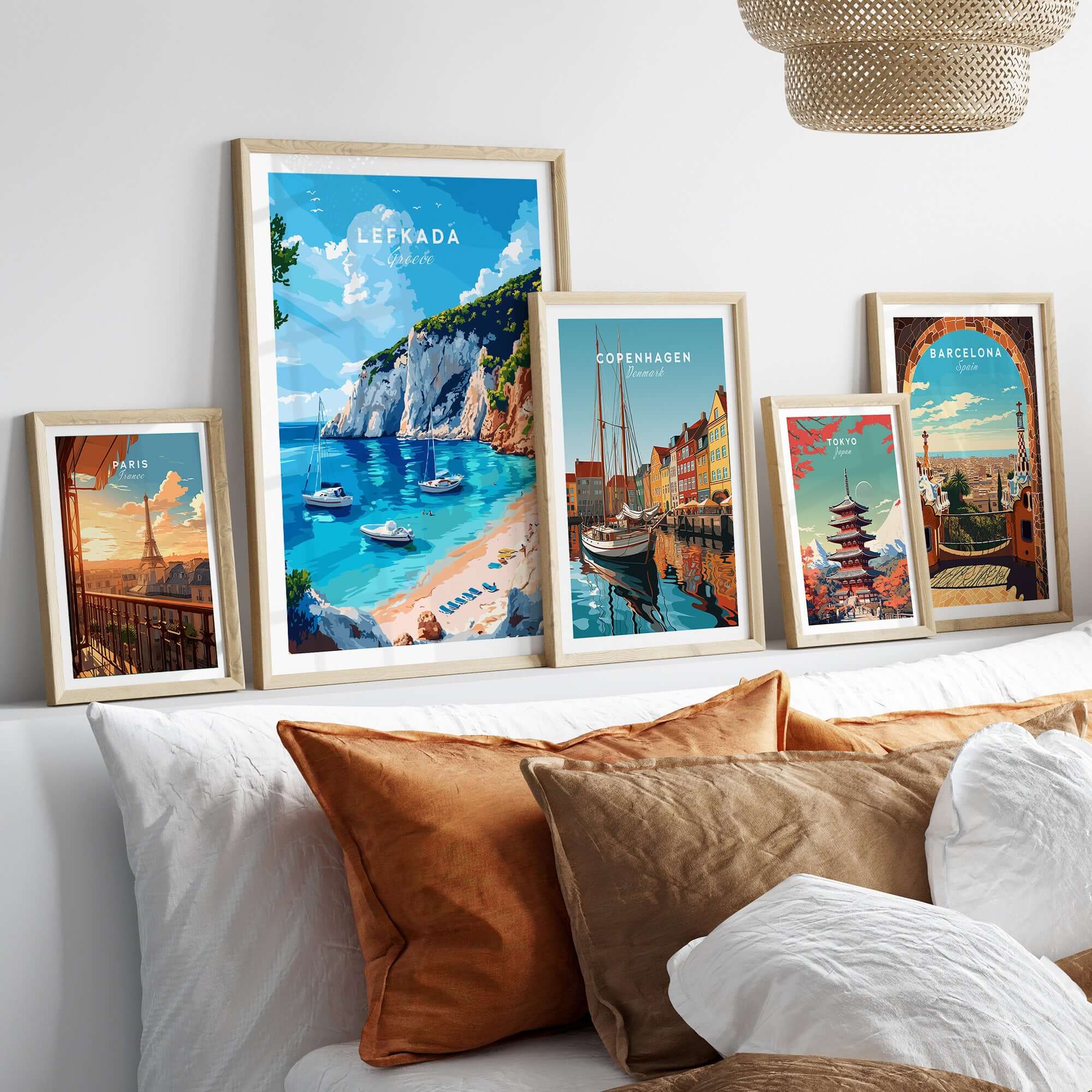 Lefkada Travel Print showcasing stunning scenes of Greece with framed travel posters on a cozy sofa.