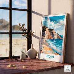 Lefkada Wall Art Print displayed by a window, showcasing a serene Greek beach scene in vibrant colors.