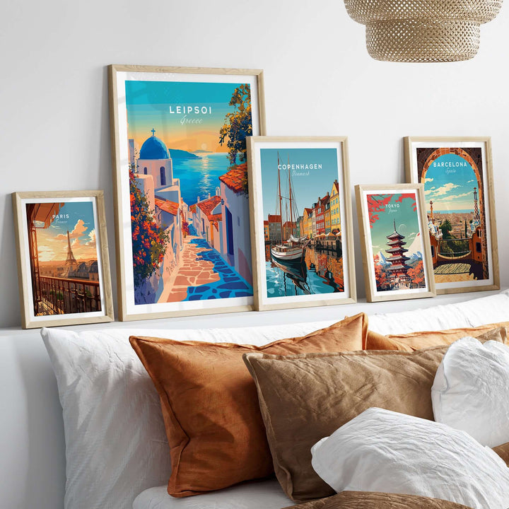 Leipsoi Wall Art showcasing vibrant Greek island scenes framed on a cozy bed with stylish decor.