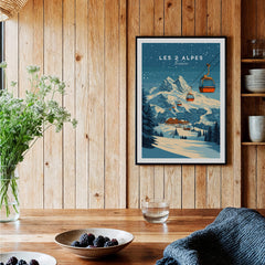 Les 2 Alpes Ski Print displayed in a cozy interior with wooden walls and fresh flowers.