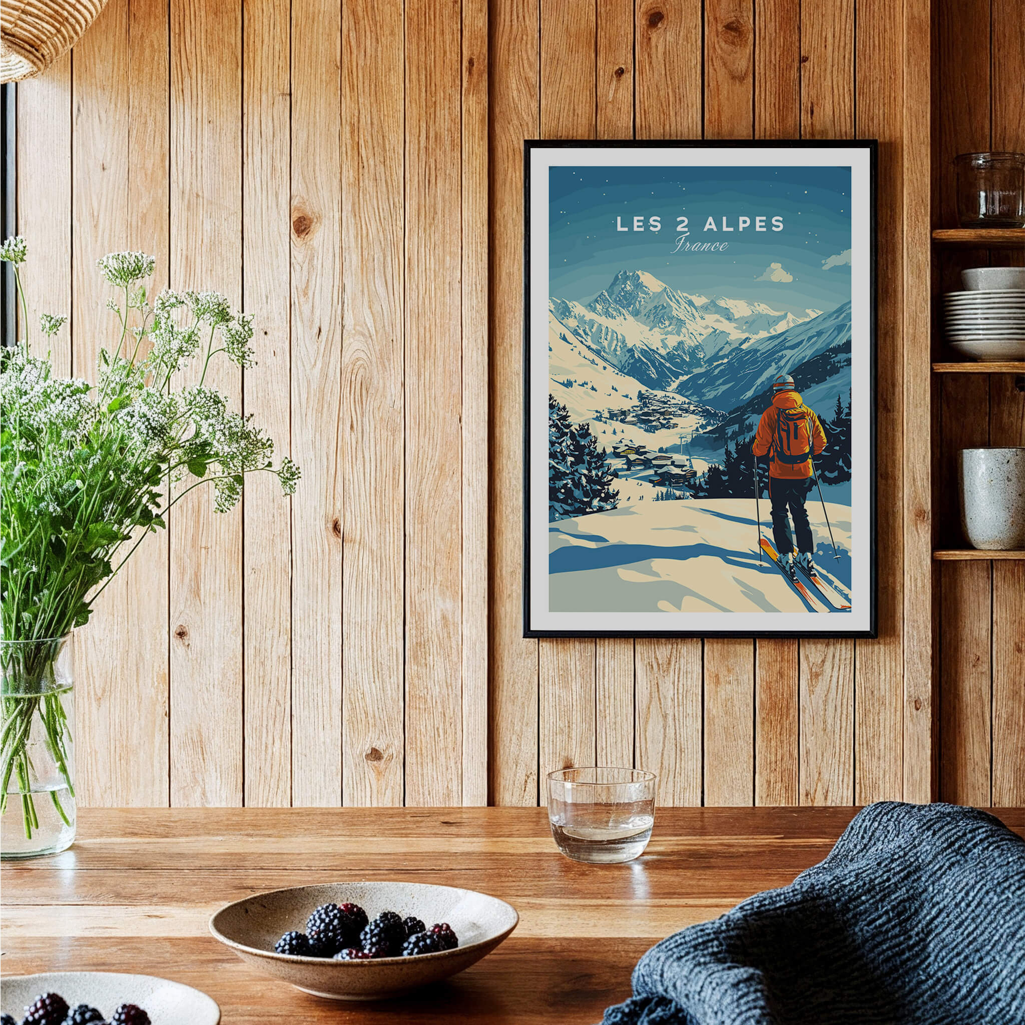 Les 2 Alpes Print France showcased on a wooden wall, featuring a skier in stunning mountain scenery.