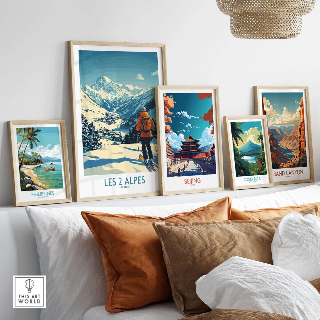 Vibrant wall display featuring Les 2 Alpes poster among travel art from Philippines, Beijing, Costa Rica, and Grand Canyon.