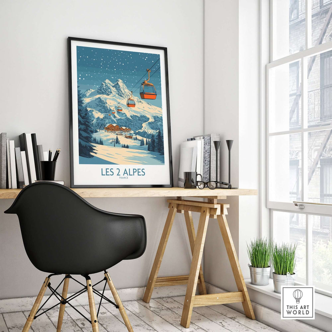 Les 2 Alpes ski poster displayed on a desk in a stylish room, capturing the beauty of the slopes and mountain scenery.