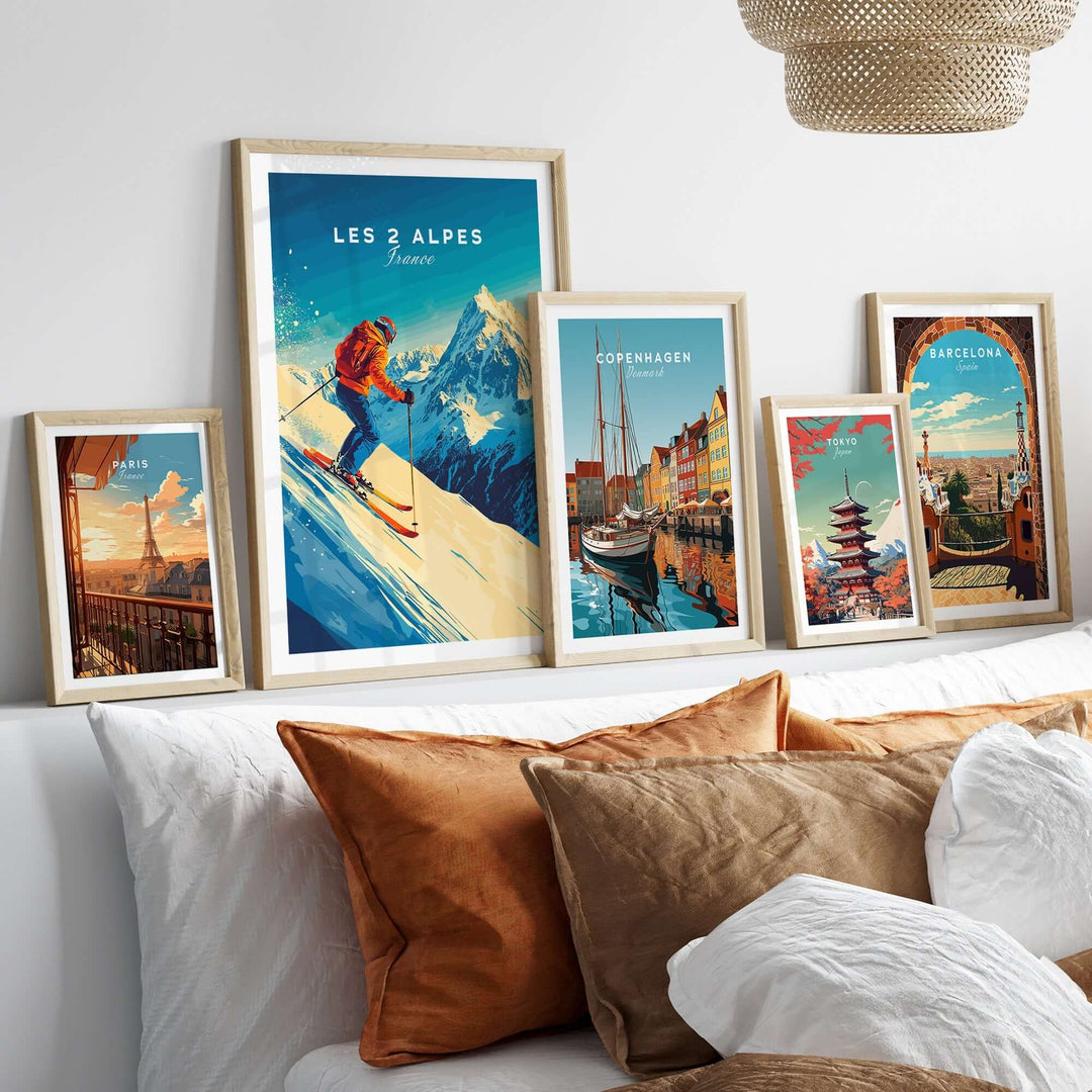 Les 2 Alpes wall art ski print displayed among various travel art prints on a stylish couch, enhancing home decor.