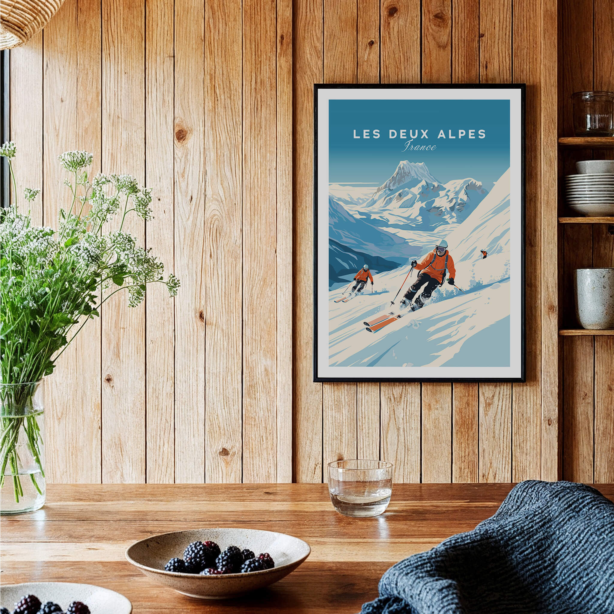 Les Deux Alpes Poster displayed in a cozy interior, showcasing a skier on snowy slopes with a beautiful mountain backdrop.