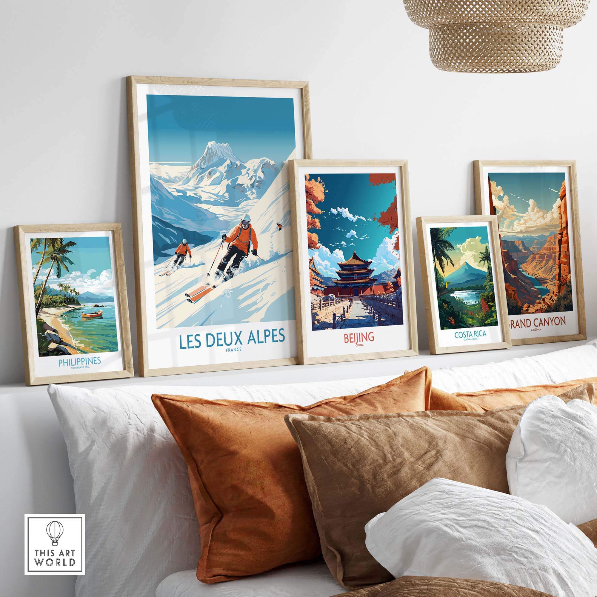 Framed Les Deux Alpes ski print among other travel posters, showcasing winter sports and scenic landscapes in home decor.