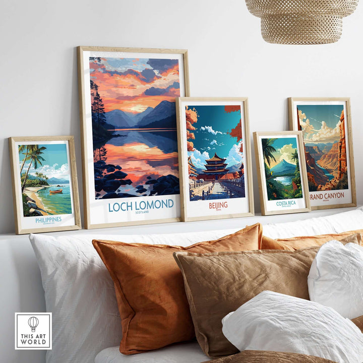 Collection of travel art prints featuring Loch Lomond, Philippines, Beijing, Costa Rica, and the Grand Canyon, displayed in a cozy setting.