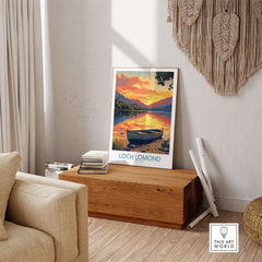 Loch Lomond Poster Scotland displayed in a cozy interior with a serene sunset over the tranquil waters.