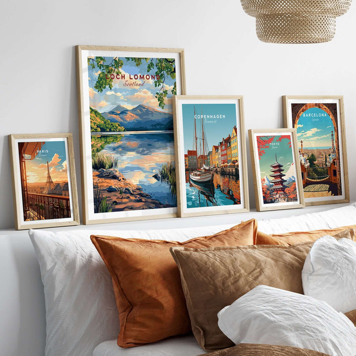 Variety of travel prints showcasing Loch Lomond, Copenhagen, and Barcelona displayed in a modern living room setting.