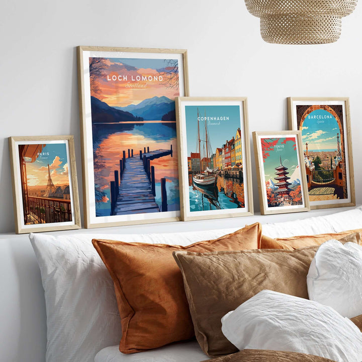 Loch Lomond travel print displayed elegantly among other travel prints on a curated wall above a cozy bed.