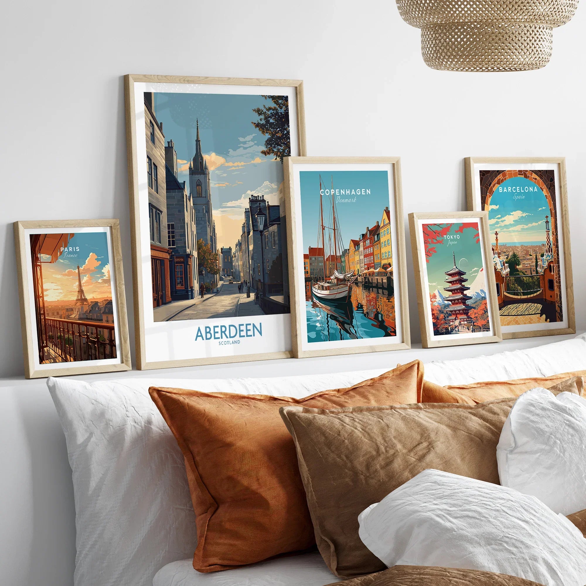 Framed travel posters of Paris, Aberdeen, Copenhagen, Tokyo, and Barcelona for wall art decor