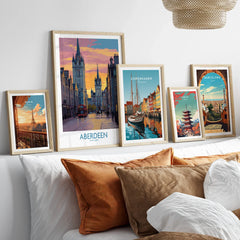 Framed travel posters of Paris, Aberdeen, Copenhagen, Tokyo, and Barcelona for wall art decor