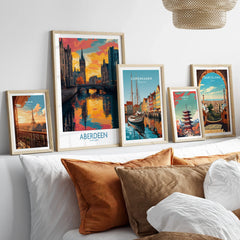 Framed travel posters of Paris, Aberdeen, Copenhagen, Tokyo, and Barcelona for wall art decor