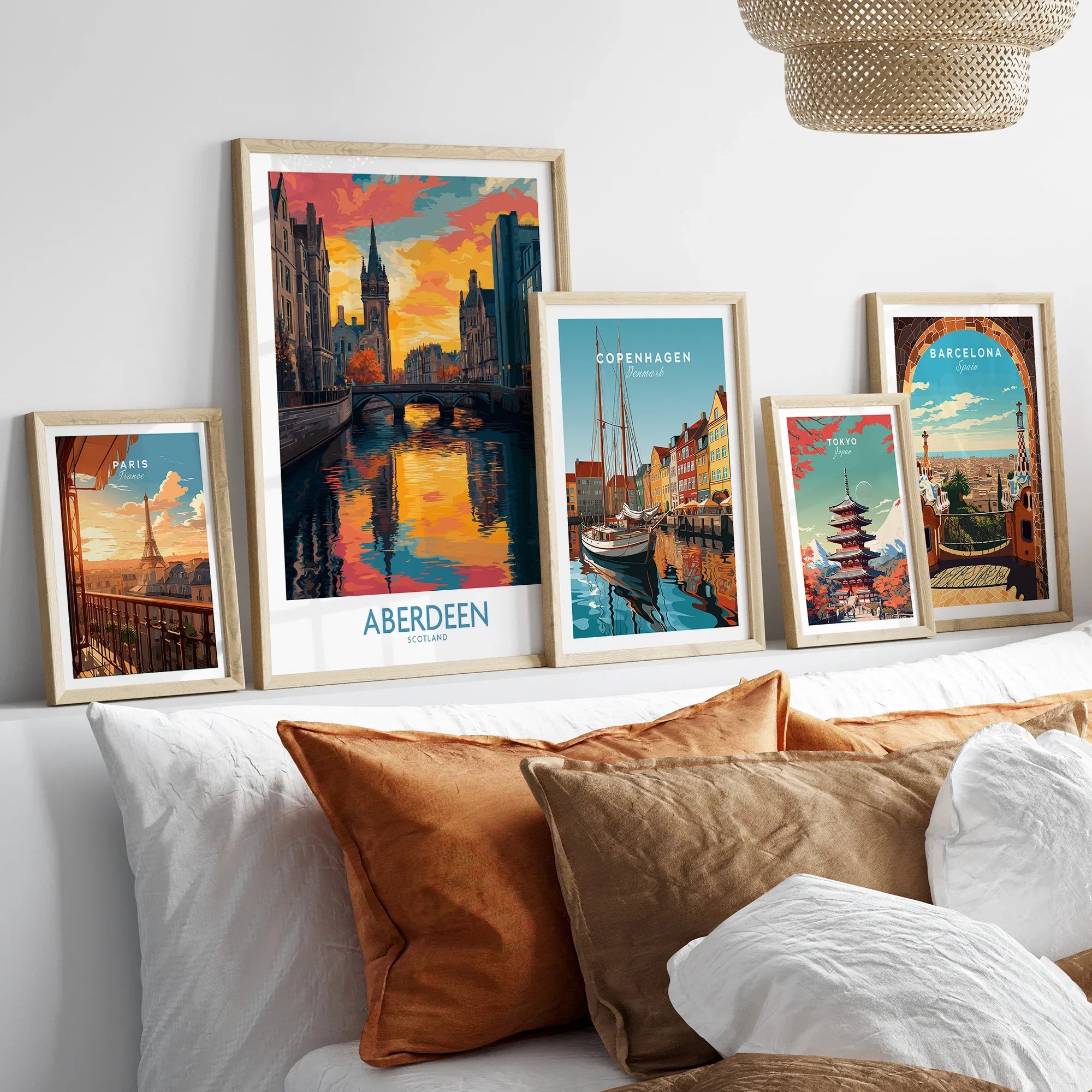 Framed travel posters of Paris, Aberdeen, Copenhagen, Tokyo, and Barcelona for wall art decor
