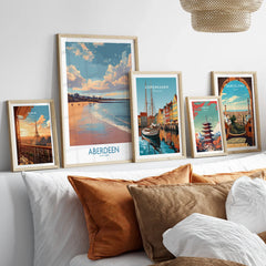 Framed travel posters of Paris, Aberdeen, Copenhagen, Tokyo, and Barcelona for wall art decor