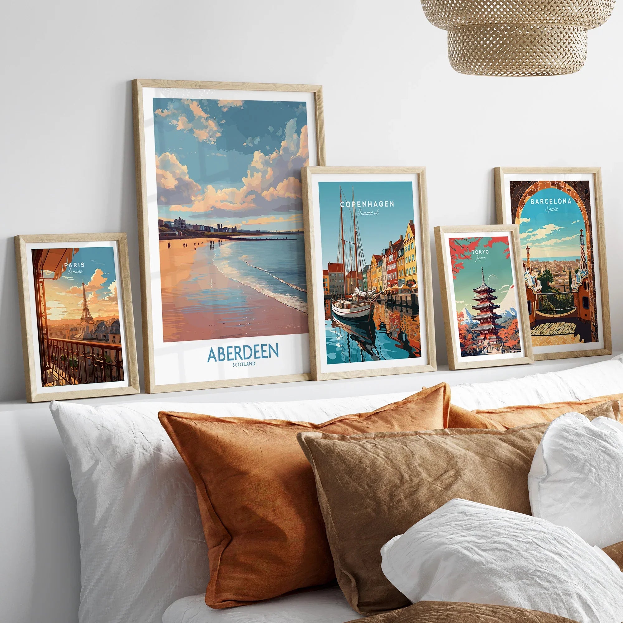 Framed travel posters of Paris, Aberdeen, Copenhagen, Tokyo, and Barcelona for wall art decor