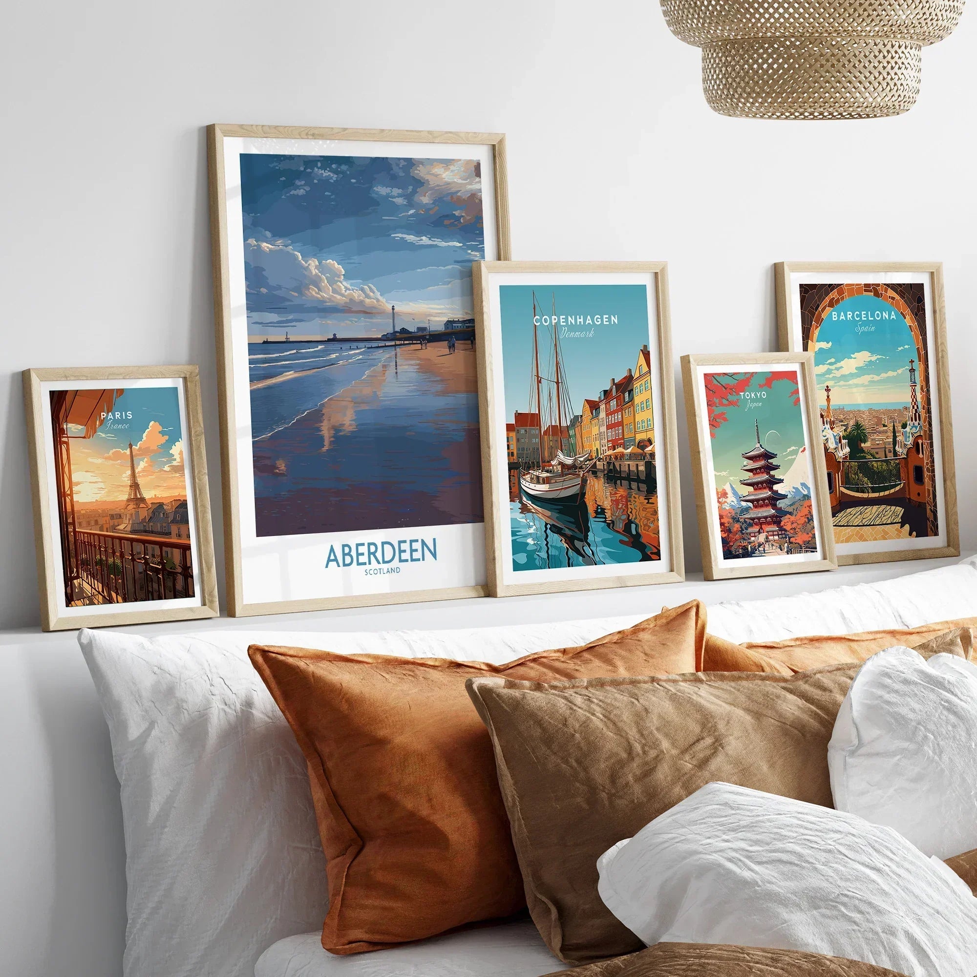 Framed travel posters of Paris, Aberdeen, Copenhagen, Tokyo, and Barcelona for wall art decor