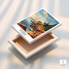 Acadia National Park Art Print displayed on an open box showcasing the vibrant coastline and lighthouse.