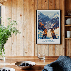 Alpe d'Huez Ski Poster showcasing stunning view of the French Alps with skis in the foreground.
