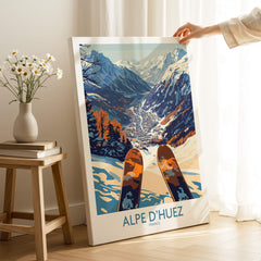 Alpe d'Huez Ski Poster featuring a stunning winter landscape with skis in the foreground and mountains in the background.