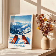 Alpe d'Huez Art Print Winter Sports showcasing a stunning winter landscape with ski boots in a cozy home setting.