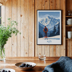 Alps Ski Print - France featuring a skier in front of snow-capped mountains in a cozy wooden setting.