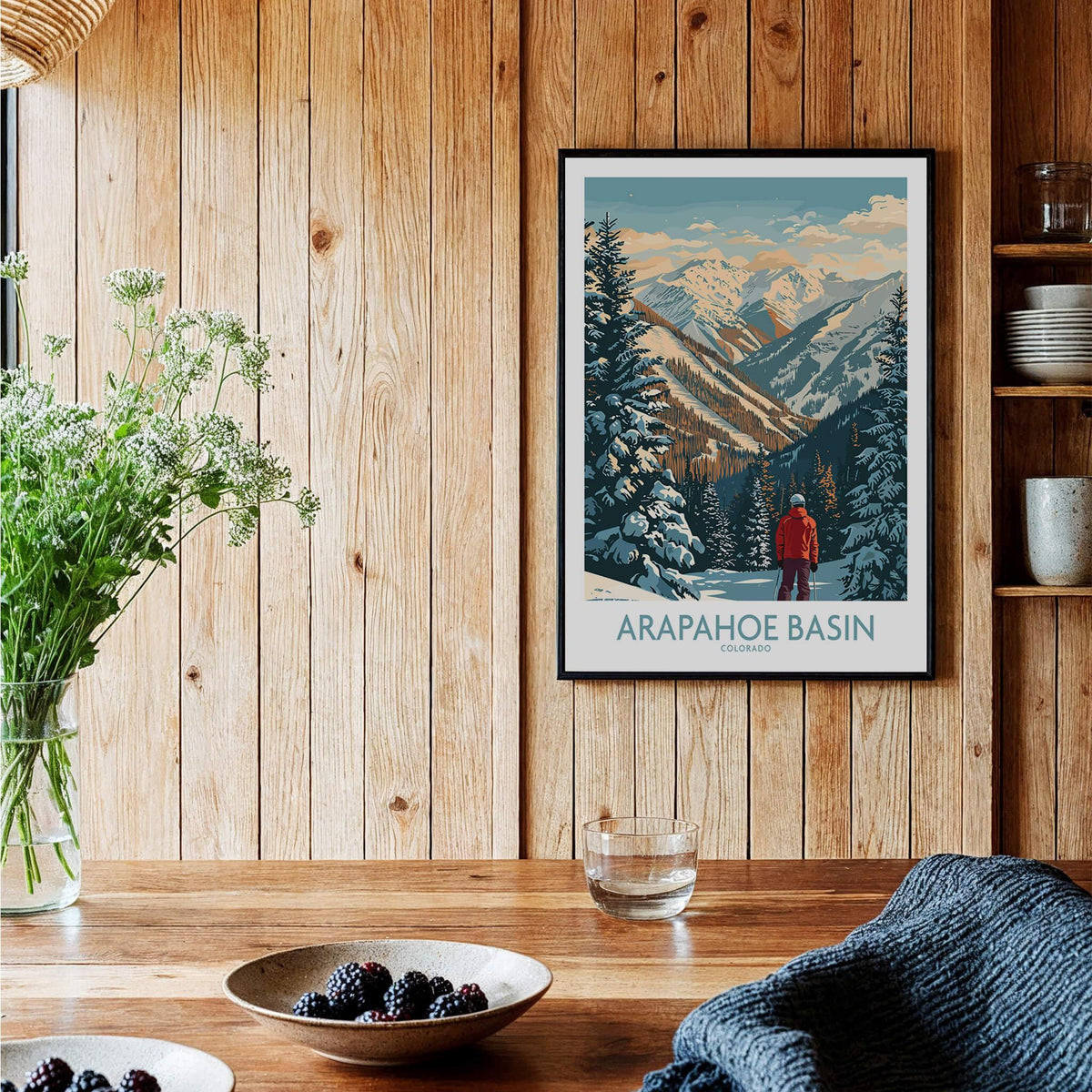 Arapahoe Basin Ski Poster displayed in a wooden decor setting, showcasing winter scenery and a skier.