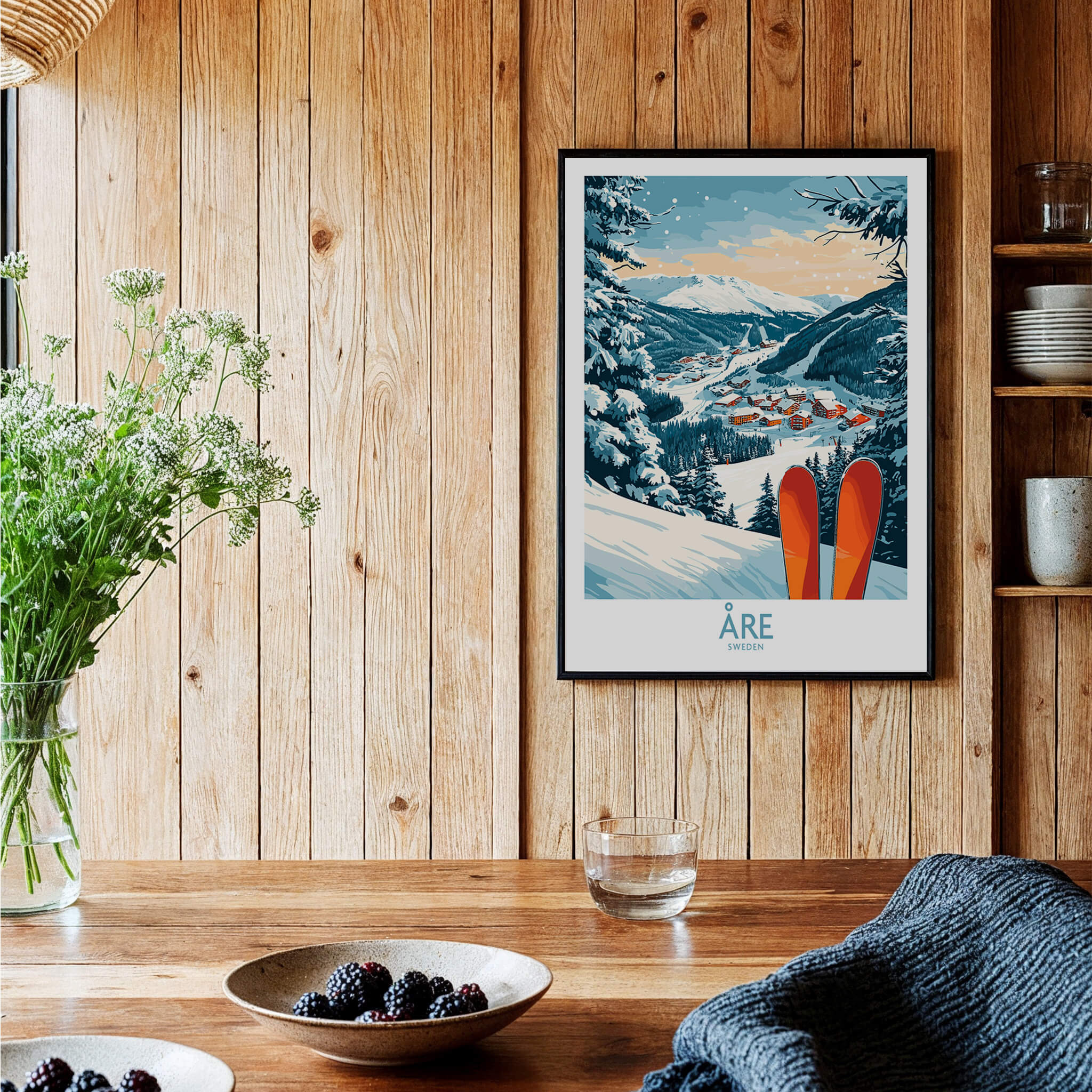 Åre Sweden Ski Poster displayed in a cozy interior with wooden walls, featuring skis and a scenic mountain view.