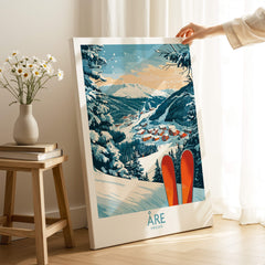 Åre Sweden Ski Poster showcasing skiing scenery and red skis in a cozy home setting.