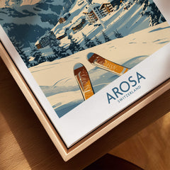 Arosa Ski Print - Switzerland, featuring skis resting on snow with Arosa town in the background.