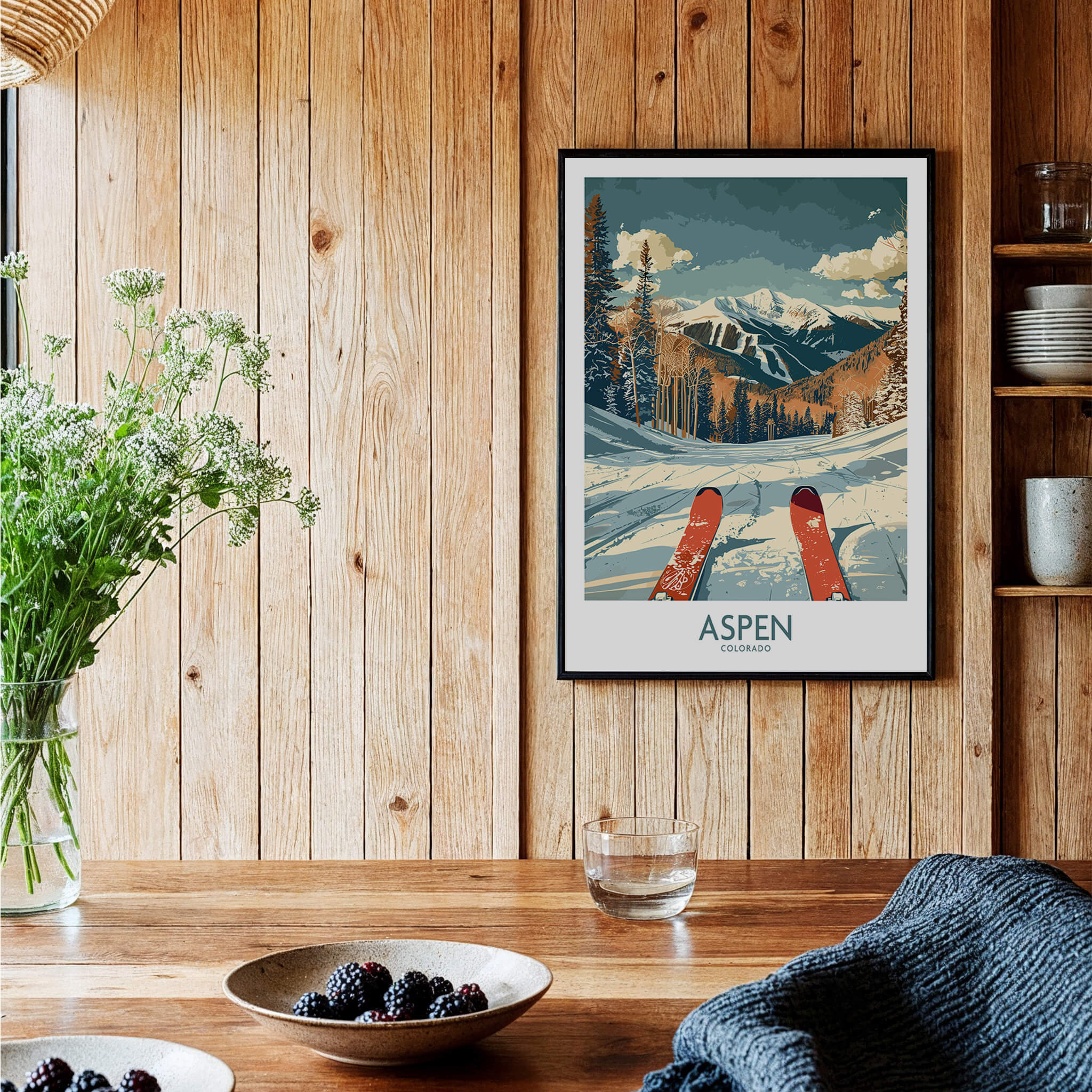 Aspen Ski Print - Colorado framed in a rustic setting with wooden panels and a table of decorative items.
