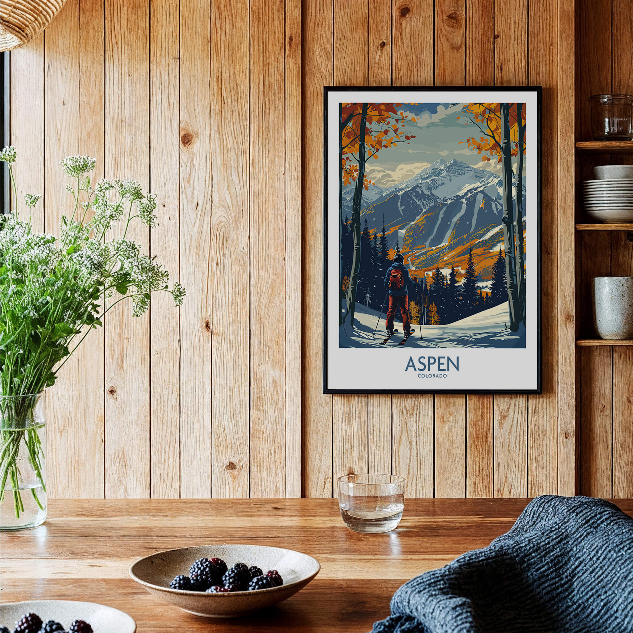 Aspen Poster Ski Print showcasing a skier in Aspen, Colorado, framed on a wooden wall, adding style to any space.