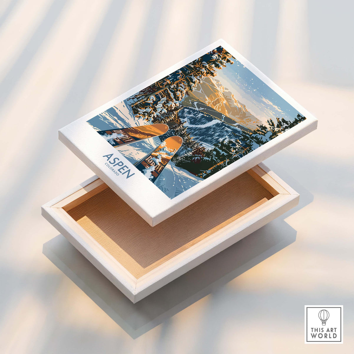 Aspen Wall Art Poster Colorado Ski Print displayed on wooden box, showcasing a winter ski scene from Colorado.