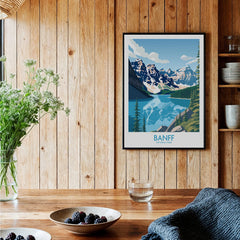 Banff National Park art print with mountain and lake scene, framed on wooden kitchen wall