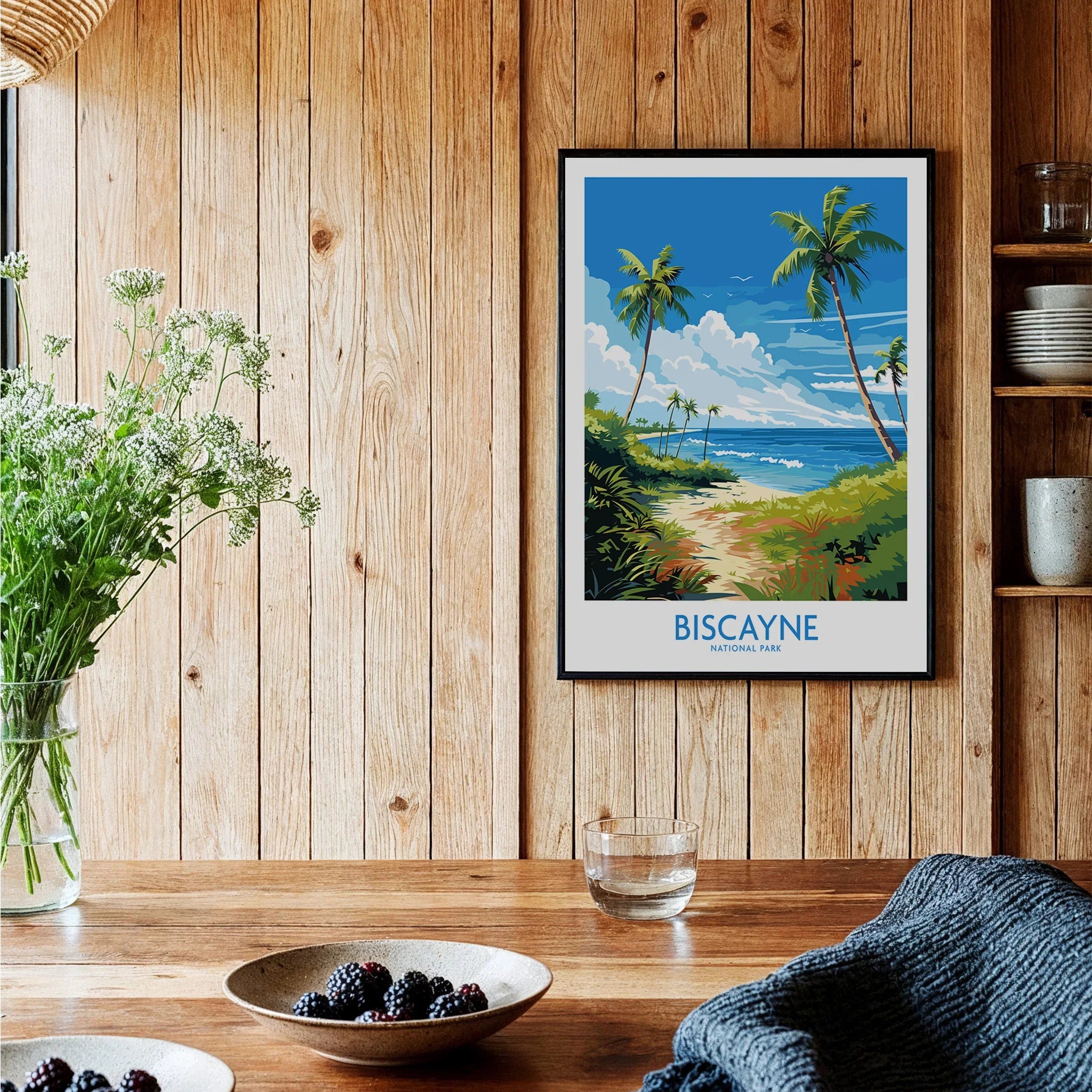 Biscayne National Park travel poster framed as wall art in a cozy wooden kitchen setting.
