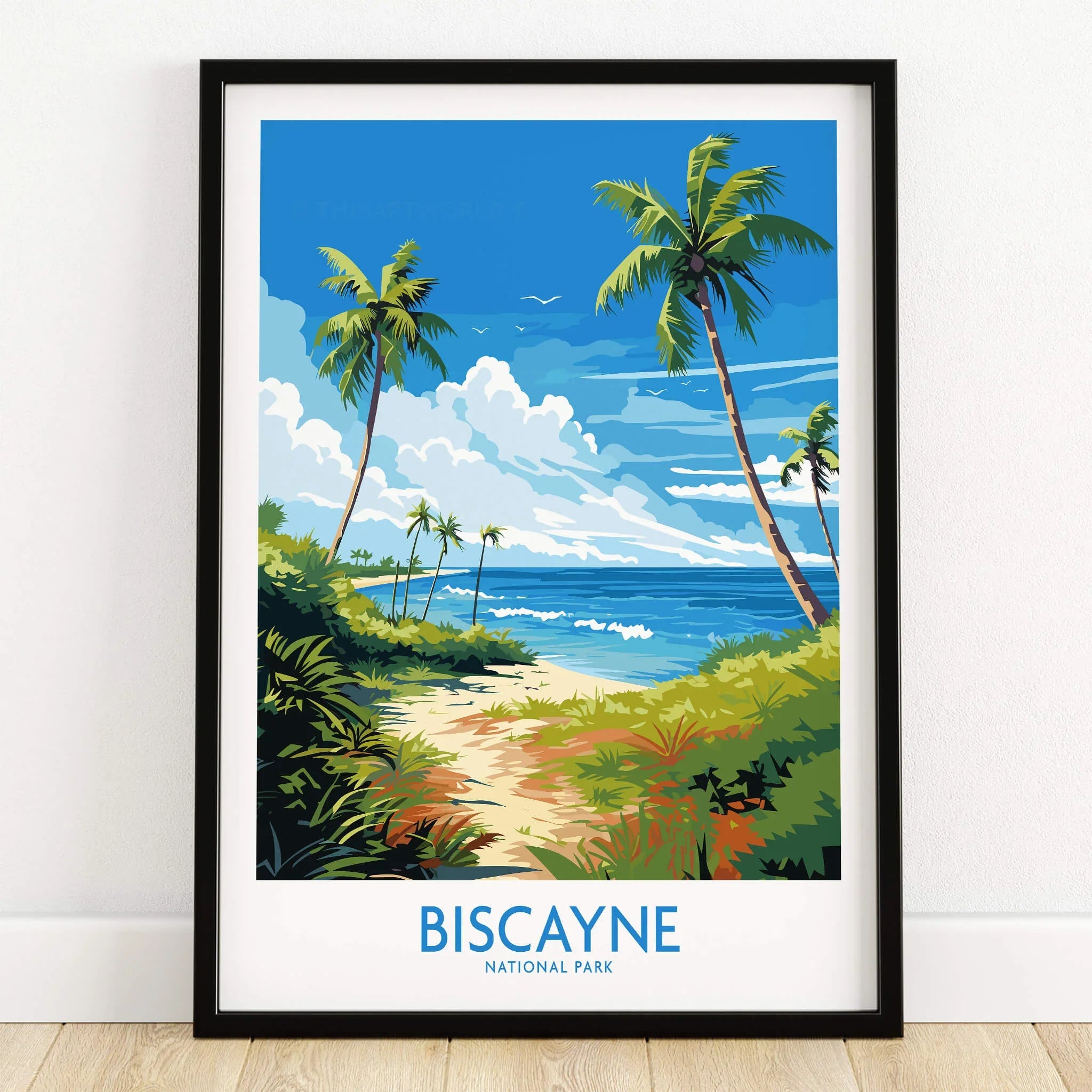 Biscayne National Park art print with palm trees, beach, and ocean in a black frame on floor