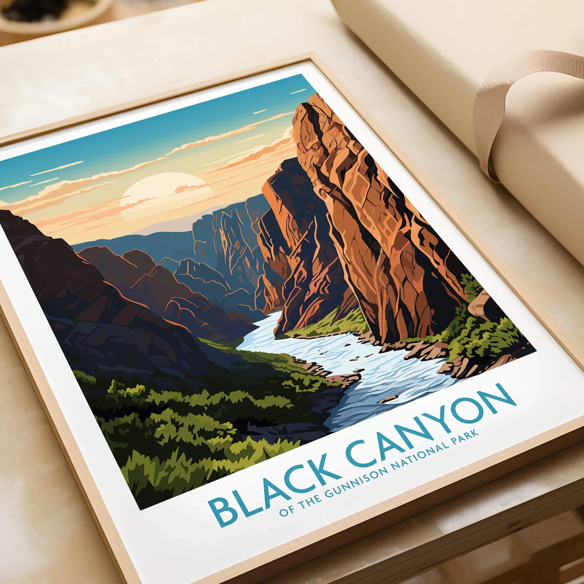 Framed Black Canyon National Park art print showing river, cliffs, and sunset, unwrapped as a gift.