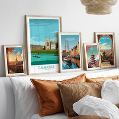 Cambridge Print wall art featuring iconic landmarks in stylish frames on a cozy sofa with decorative pillows.