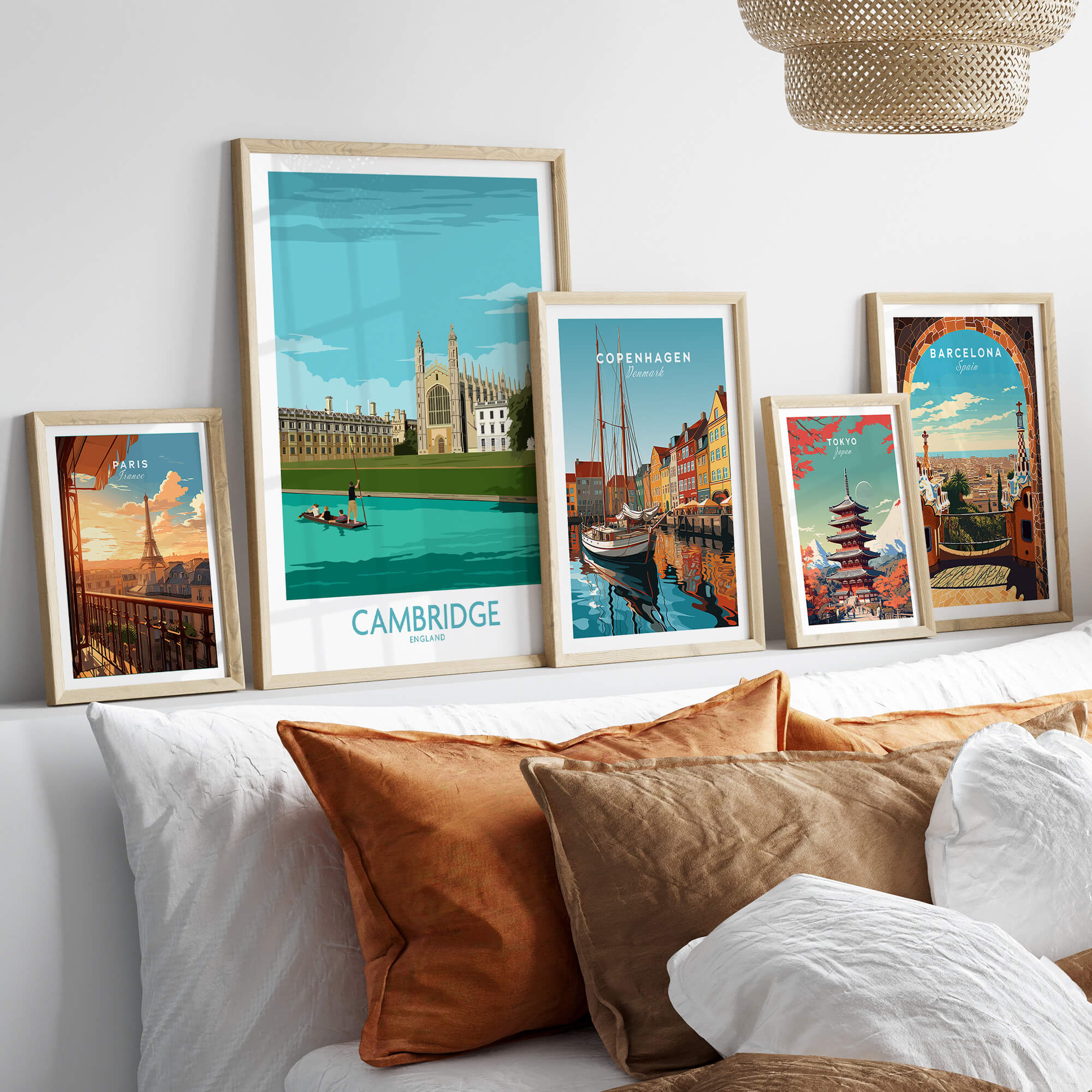 Cambridge Print wall art featuring iconic landmarks in stylish frames on a cozy sofa with decorative pillows.