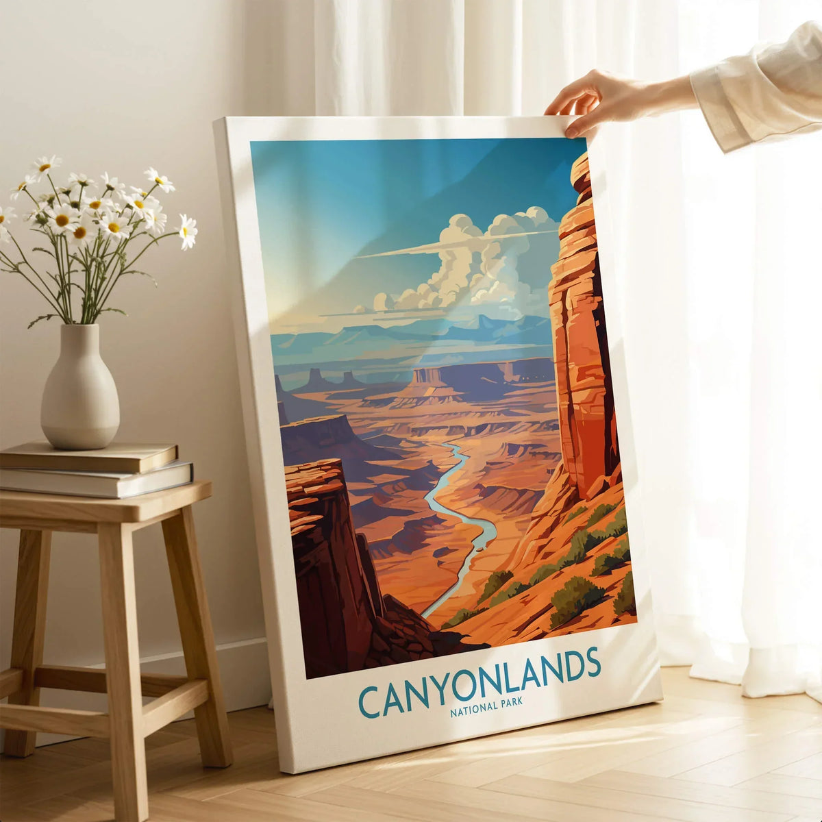 Person holding Canyonlands National Park art print, river canyon landscape in cozy room