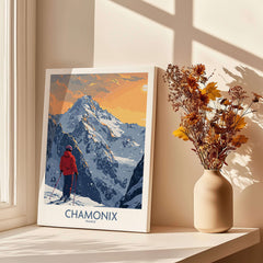 Chamonix Ski Print - France showcasing a skier on a snowy mountain with a sunset backdrop in a cozy interior setting.