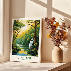 Congaree National Park poster with heron, canvas print on windowsill beside vase of dried flowers