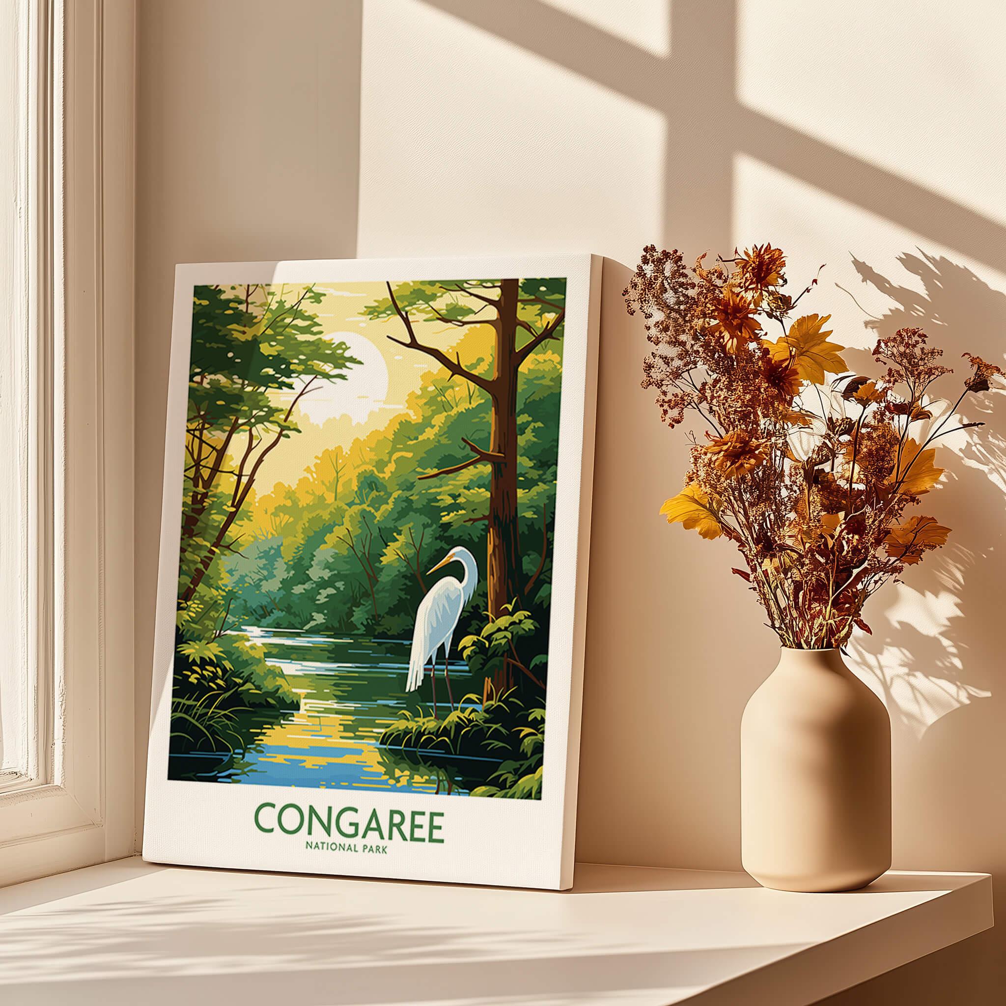 Congaree National Park poster with heron, canvas print on windowsill beside vase of dried flowers