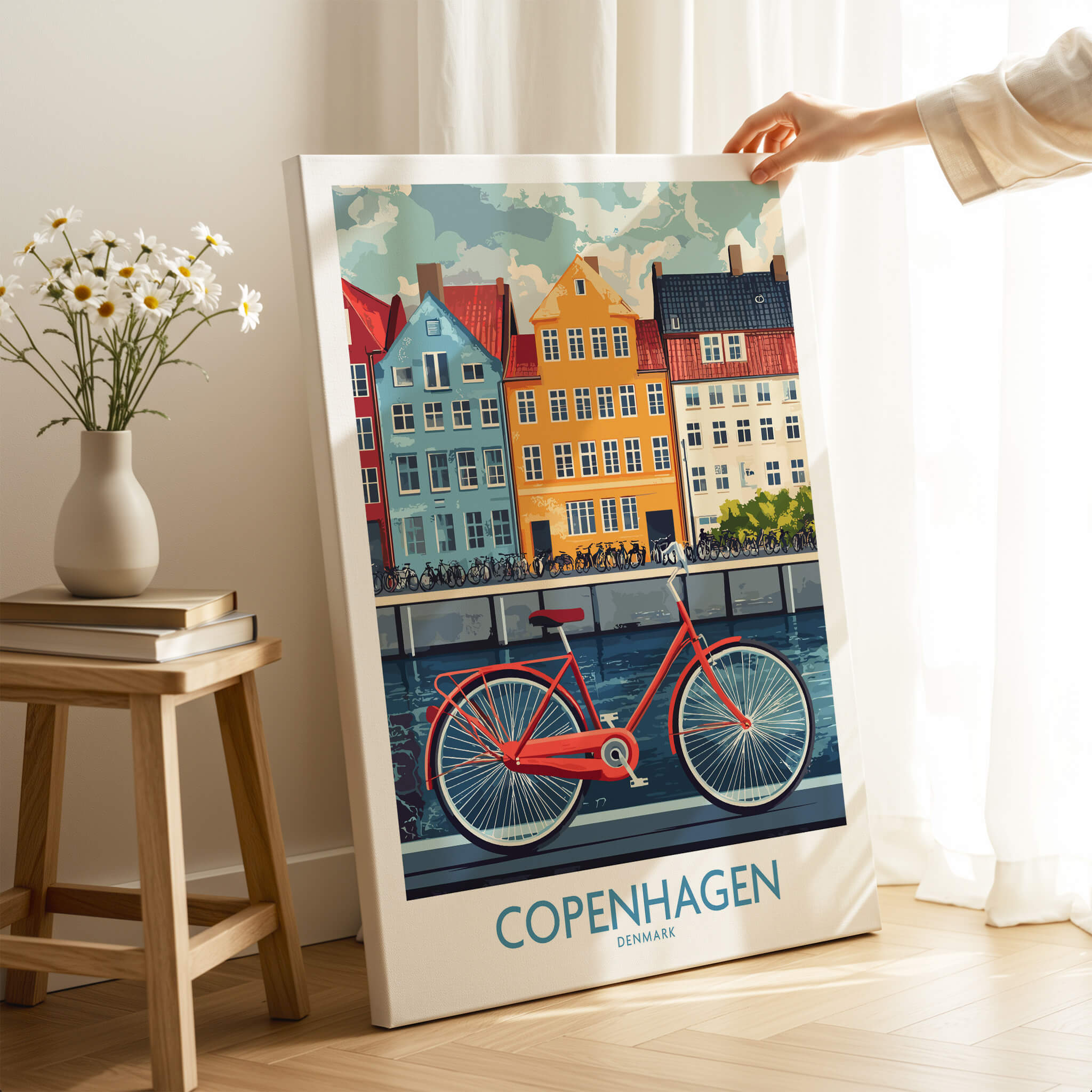 Denmark Copenhagen Poster - Red Bike, Colorful Canal Houses Art displayed in a bright interior with a vase of flowers.