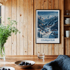Courmayeur Ski Print - Italy displayed on wooden wall with greenery and table decor.