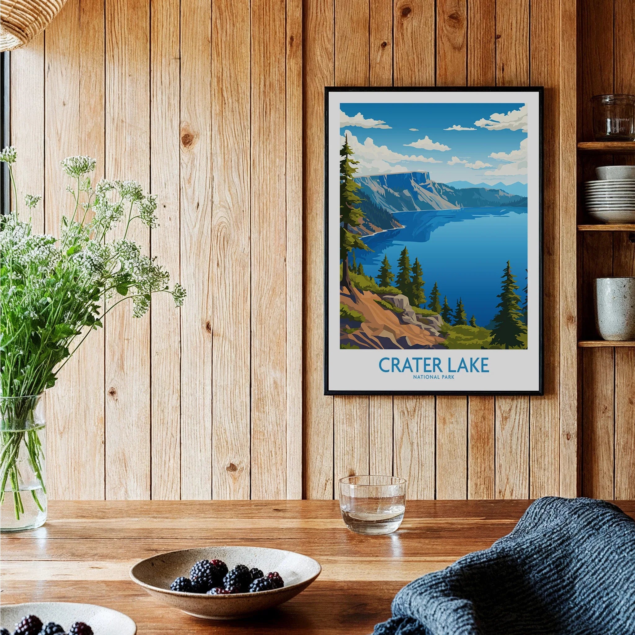Crater Lake National Park art print in black frame hanging on wooden kitchen wall decor.