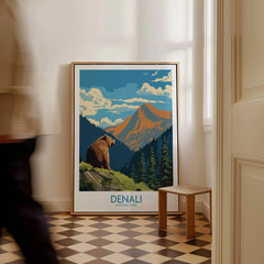 Framed Denali National Park travel poster with bear and mountains, resting on floor